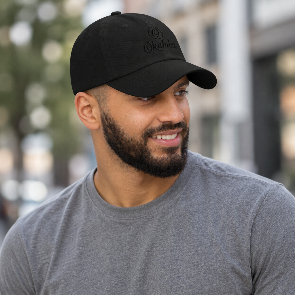 Okahrba Signature Dad Hat in black, worn outdoors